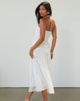 Woven midi dress. Halter tie neckline. Front v-wire. Front cut outs. Ruched bodice. Back hook and eye and zipper closures. Fully lined. Bride. Bridal dress. Engagement dress. Bridal shower dress. summer dress. white midi dress. white halter neck dress