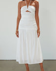 Woven midi dress. Halter tie neckline. Front v-wire. Front cut outs. Ruched bodice. Back hook and eye and zipper closures. Fully lined. Bride. Bridal dress. Engagement dress. Bridal shower dress. summer dress. white midi dress. white halter neck dress