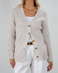 Fuzzy heather crochet knit cardigan. Front button down closures. Unlined.