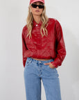 Red Vegan leather bomber jacket. Collar neckline. Snap button long sleeve closures. Front snap button down closures. Front pockets. Elastic hem. Fully lined. fall jacket. fall outfit
