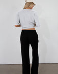 Ribbed knit pants. Elastic waistband. Side pockets. Unlined. black lounge pant