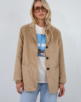 Vegan suede single breasted jacket. Collar neckline. Front button down closure. Front pockets. Back slit. Fully lined. faux suede blazer jacket. fall jacket. fall outfit