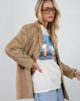 Vegan suede single breasted jacket. Collar neckline. Front button down closure. Front pockets. Back slit. Fully lined. faux suede blazer jacket. fall jacket. fall outfit