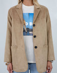 Vegan suede single breasted jacket. Collar neckline. Front button down closure. Front pockets. Back slit. Fully lined. faux suede blazer jacket. fall jacket. fall outfit