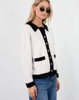 Colorblocked fuzzy crochet knit cardigan. Collar neckline. Front button down closure. Front pockets. Unlined. white cardigan. white and black cardigan. fall sweater. fall outfit. classy cardigan sweater. cardigan sweater