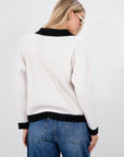 Colorblocked fuzzy crochet knit cardigan. Collar neckline. Front button down closure. Front pockets. Unlined. white cardigan. white and black cardigan. fall sweater. fall outfit. classy cardigan sweater. cardigan sweater