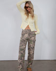 Camo printed cargo jeans. Side and back pockets. Button and zipper fly. Unlined.