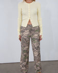 Camo printed cargo jeans. Side and back pockets. Button and zipper fly. Unlined.