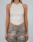 Seamed vegan leather crop top. Halter neckline with back button closure. Back hook and eye and zipper closures. Fully lined. leather halter top going out top.