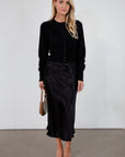 Black satin maxi skirt. Elastic waist. Side hook and eye and zipper closures. Unlined. fall skirt. fall bottom. holiday skirt