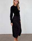 Black satin maxi skirt. Elastic waist. Side hook and eye and zipper closures. Unlined. fall skirt. fall bottom. holiday skirt