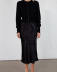 Black satin maxi skirt. Elastic waist. Side hook and eye and zipper closures. Unlined. fall skirt. fall bottom. holiday skirt