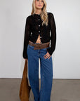 black Crochet knit cardigan. Long sleeves. Front button down closures. Unlined. fall top. fall outfit.