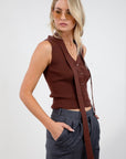 Ribbed knit sleeveless top. V-neckline. Front button down closure. Unlined. Neck tie. brown vest top. top with scarf. fall top.
