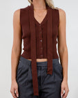 Ribbed knit sleeveless top. V-neckline. Front button down closure. Unlined. Neck tie. brown vest top. top with scarf. fall top.