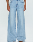 Low slung palazzo jeans. Button and zipper fly. Five pocket construction. Unlined. No stretch. baggy jeans. flare pant. light wash denim jeans