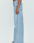 Low slung palazzo jeans. Button and zipper fly. Five pocket construction. Unlined. No stretch. baggy jeans. flare pant. light wash denim jeans