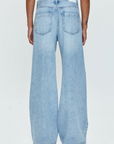 Low slung palazzo jeans. Button and zipper fly. Five pocket construction. Unlined. No stretch. baggy jeans. flare pant. light wash denim jeans