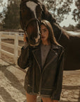 Faux leather jacket. Front zipper closure. Long sleeves either zipper closures. Front zipper pockets. Snap button closures. Fully lined. Brown leather jacket. brown oversized leather jacket. western outfit. ranch outfit