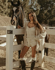 Smocked bloomer shorts. Elastic waistband with leg openings. Drawstring waist. Fully lined. white shorts. cream shorts