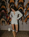 Fuzzy heather knit bodysuit. Long sleeves. Front button down closures. Snap bottom closures. Thong back. Fuzzy heather knit shorts. Unlined. grey knit set
