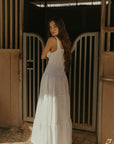 Woven maxi dress. Elastic straps. Faux front tie and button down closures. Tiered skirt. Elastic smocked back panel. Fully lined. white maxi dress