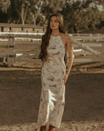 Printed satin maxi dress. Halter neckline with back tie closure. Side zipper closure. Fully lined. horse dress. ranch shoot.