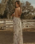Printed satin maxi dress. Halter neckline with back tie closure. Side zipper closure. Fully lined. horse dress. ranch shoot.