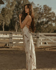 Printed satin maxi dress. Halter neckline with back tie closure. Side zipper closure. Fully lined. horse dress. ranch shoot.