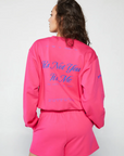 Graphic printed knit sweatshirt. Cropped fit. Unlined. Pink cropped oversized sweater. Airport outfit. Loungewear. Relaxing outfit.