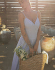 Striped woven maxi dress. Adjustable straps. Elastic smocked back. Back hook and eye and zipper closures. Unlined. European summer. European summer dress. European summer aesthetic. Tuscany outfit inso. Tuscany aesthetic. Summer dress. blue and white striped maxi dress. striped maxi dress. summer outfit. everyday dress. vacation dress. outfit to wear to tuscany. nice dinner dress. dinner dress. day dress.