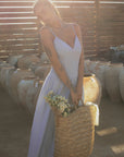 Striped woven maxi dress. Adjustable straps. Elastic smocked back. Back hook and eye and zipper closures. Unlined. European summer. European summer dress. European summer aesthetic. Tuscany outfit inso. Tuscany aesthetic. Summer dress. blue and white striped maxi dress. striped maxi dress. summer outfit. everyday dress. vacation dress. outfit to wear to tuscany. nice dinner dress. dinner dress. day dress.