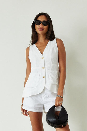 Woven sleeveless top. Front button down closure. Front pockets. Fully lined. white vest top. summer top. summer outfit. cute casual. cute but comfy top