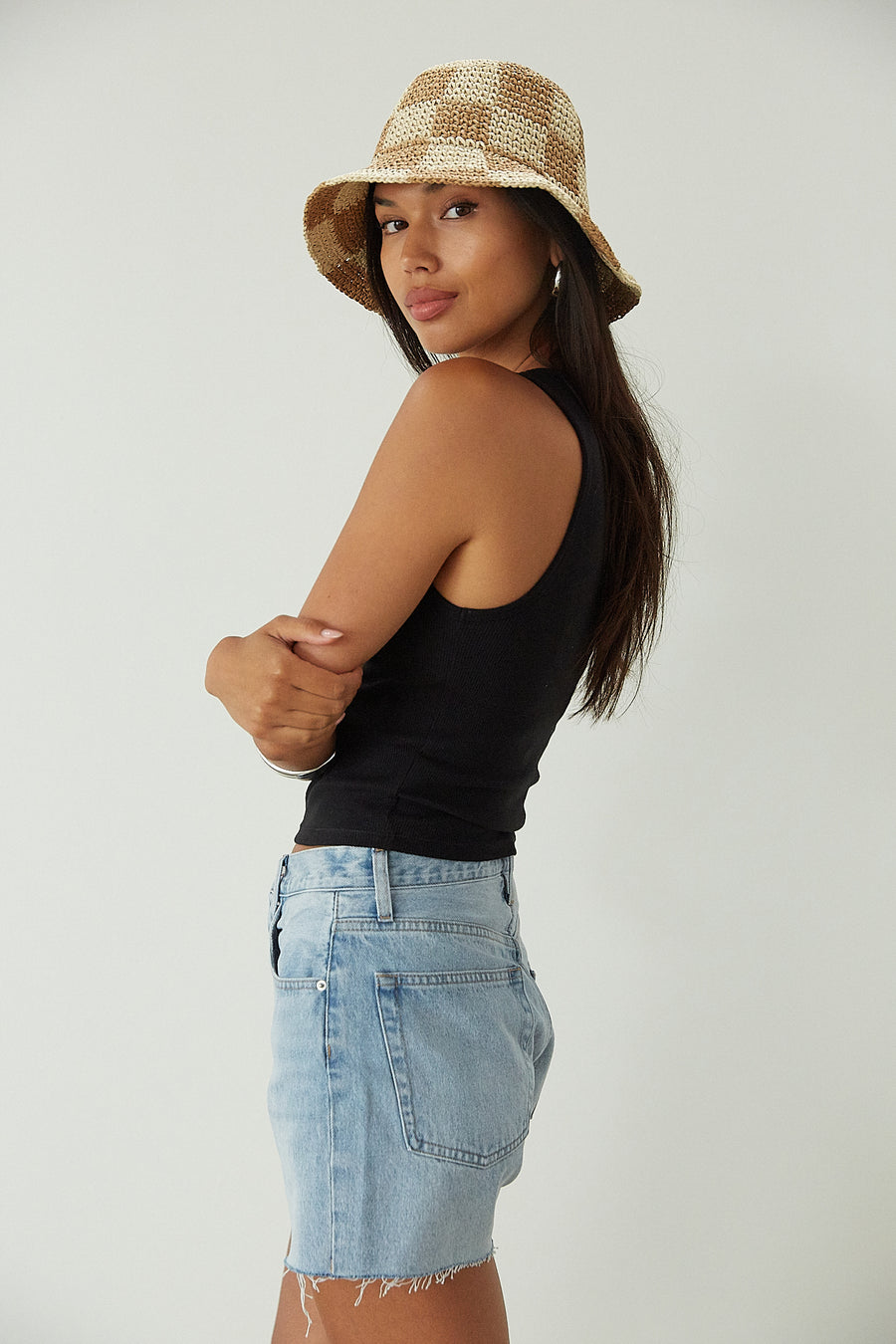 Relax fit mid-length denim shorts. Button fly. Five pocket construction. Raw hem. Unlined. denim shorts. light wash denim shorts. medium wash denim shorts