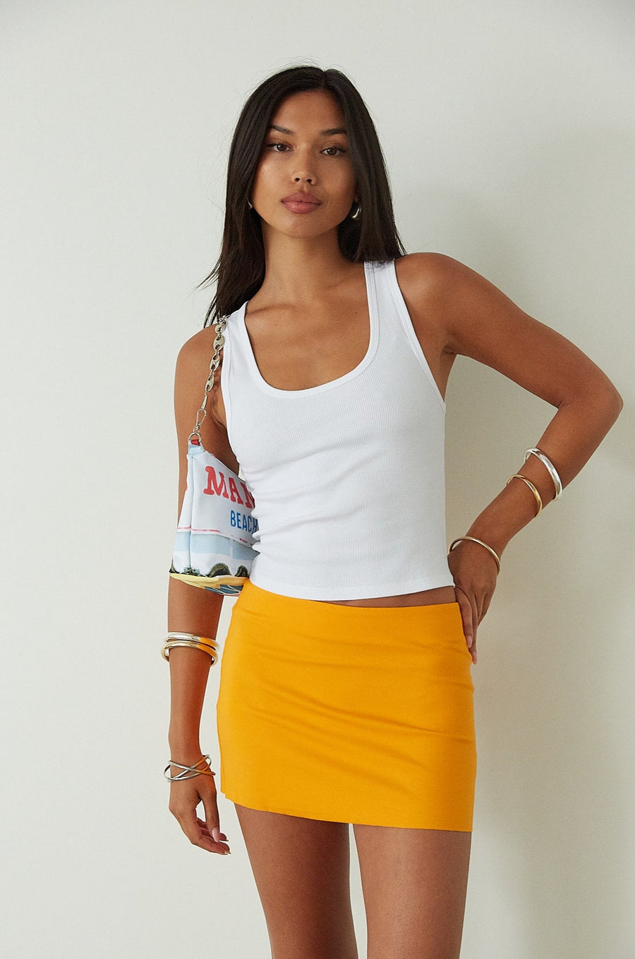 orange mini skirt. summer bottoms. summer skirt. going out outfit. going out skirt. summer outfit