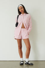 Striped boxer shorts. pink boxer shorts. pink striped boxer shorts. boxer short set. cute casual outfit. pink button up shirt. lounge set. pink lounge set. summer outfit. cute summer outfit.