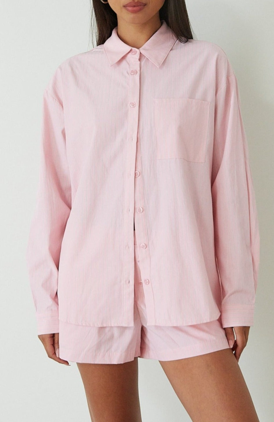 Striped boxer shorts. pink boxer shorts. pink striped boxer shorts. boxer short set. cute casual outfit. pink button up shirt. lounge set. pink lounge set. summer outfit. cute summer outfit.