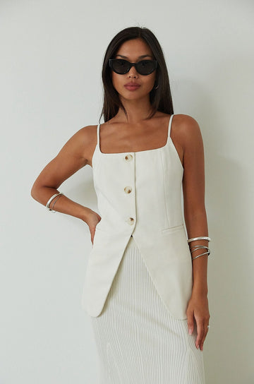 Woven sleeveless top. Adjustable straps. Front button down closures. Faux front pockets. Fully lined. Summer tank top. summer top. white tank top. cream tank top. going out top. evening top. 