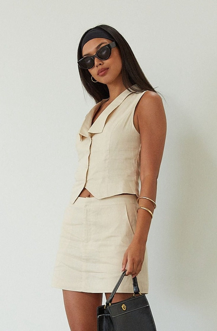 Woven sleeveless top. Front button down closure. Fully lined. Woven skirt. Hook and eye and zipper fly. Side pockets. Fully lined. summer set. cute casual outfit. summer outfit. skirt set. vest top set. tan skirt and vest set
