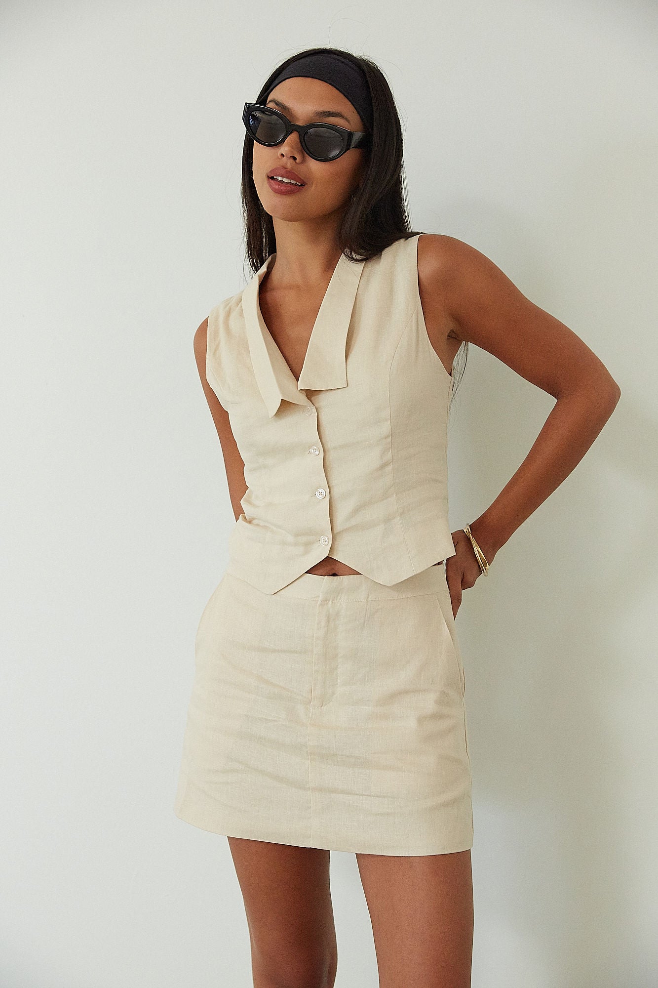 Woven sleeveless top. Front button down closure. Fully lined. Woven skirt. Hook and eye and zipper fly. Side pockets. Fully lined. summer set. cute casual outfit. summer outfit. skirt set. vest top set. tan skirt and vest set