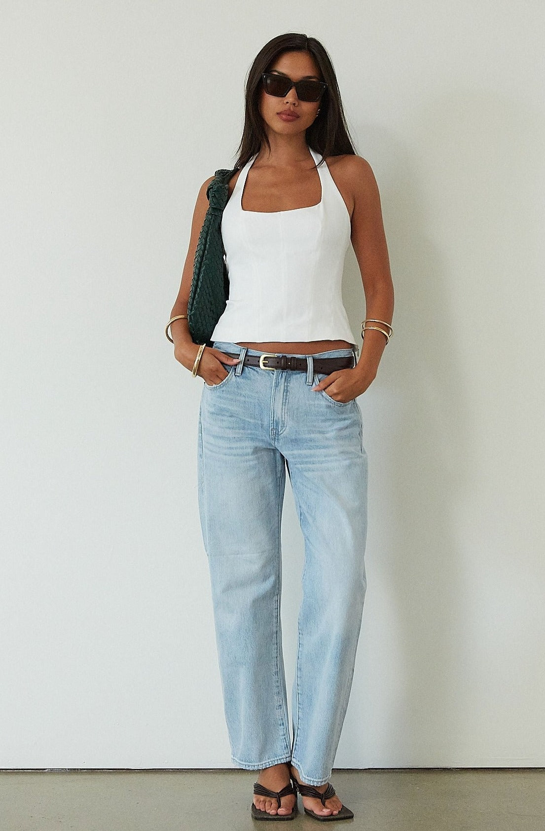 Mid rise bowed straight leg jeans. Button and zipper fly. Five pocket construction.&nbsp;Straight leg bows at the knees for an arched, barrel leg silhouette. Ankle length crop with a clean hem. No stretch.&nbsp;
