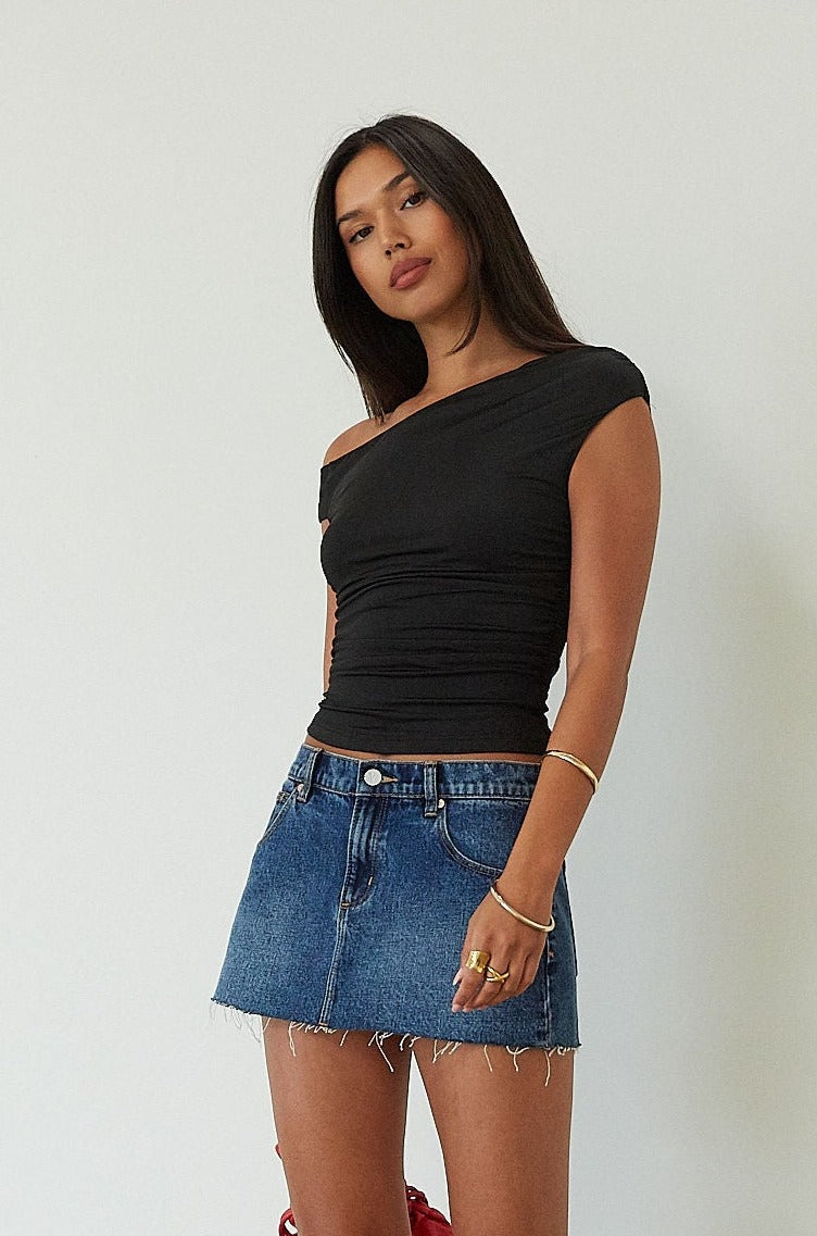 Denim skirt. Button and zipper fly. Five pocket construction. Raw edge hem. Unlined. mid wash denim skirt. dark wash denim skirt. denim mini skirt. summer skirt