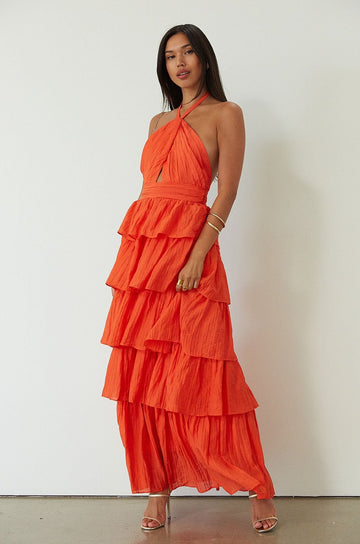 Crinkle woven tiered maxi dress. Adjustable halter tie neckline. Back hook and eye and zipper closures. Fully lined. orange maxi dress. wedding guest dress. evening dress. vacation dress. fancy dinner dress