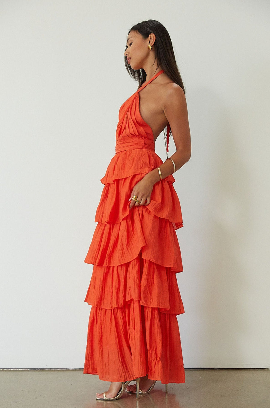 Crinkle woven tiered maxi dress. Adjustable halter tie neckline. Back hook and eye and zipper closures. Fully lined. orange maxi dress. wedding guest dress. evening dress. vacation dress. fancy dinner dress
