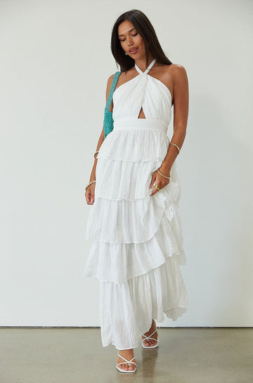 Crinkle woven tiered maxi dress. Adjustable halter tie neckline. Back hook and eye and zipper closures. Fully lined. white maxi dress. wedding guest dress. evening dress. vacation dress. fancy dinner dress. engagement dress. bridal shower dress.