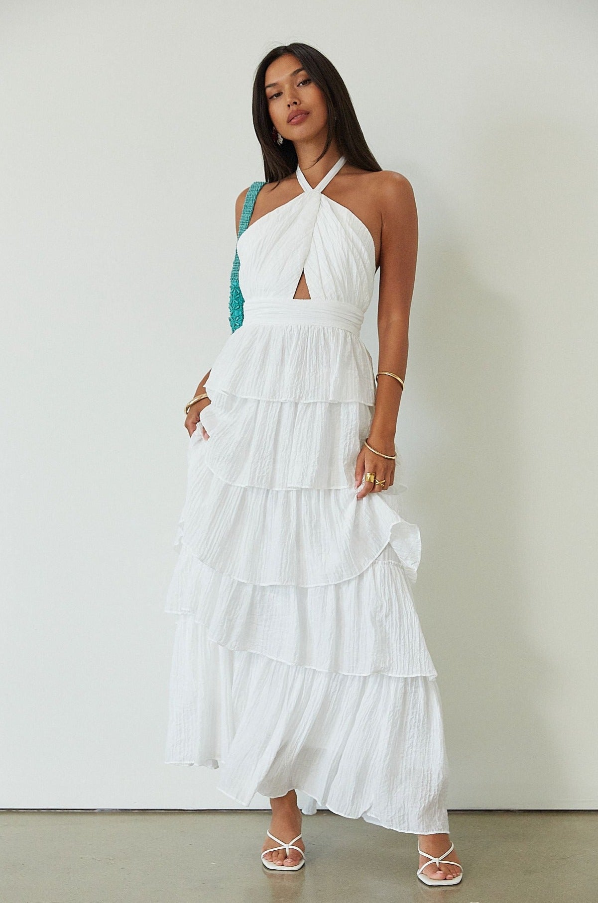 Crinkle woven tiered maxi dress. Adjustable halter tie neckline. Back hook and eye and zipper closures. Fully lined. white maxi dress. wedding guest dress. evening dress. vacation dress. fancy dinner dress. engagement dress. bridal shower dress.