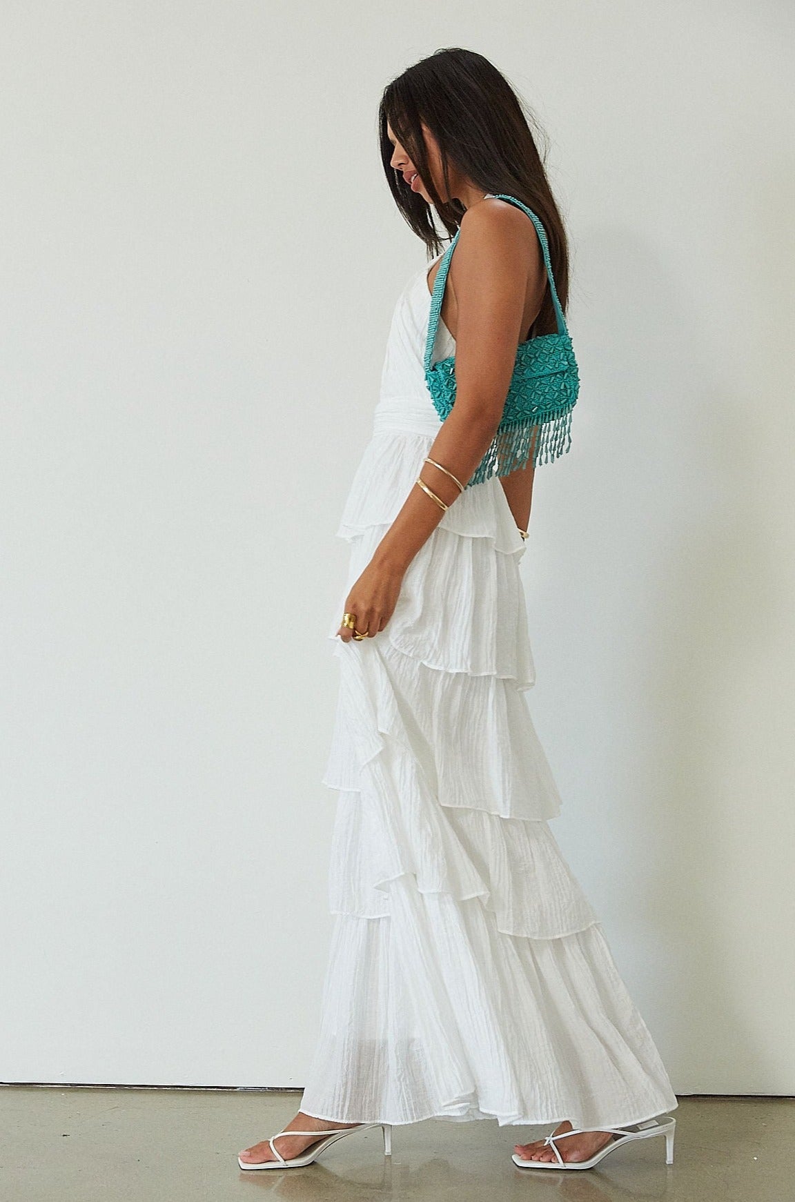 Crinkle woven tiered maxi dress. Adjustable halter tie neckline. Back hook and eye and zipper closures. Fully lined. white maxi dress. wedding guest dress. evening dress. vacation dress. fancy dinner dress. engagement dress. bridal shower dress.
