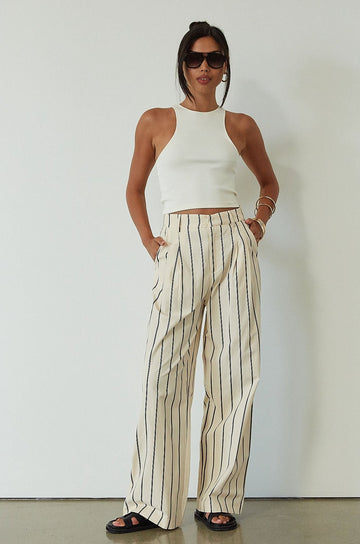 Striped woven pants. Hook and eye and zipper fly. Side pockets. Unlined. beige striped pant. work pant. casual work pant. vacation outfit. vacation pant. 
