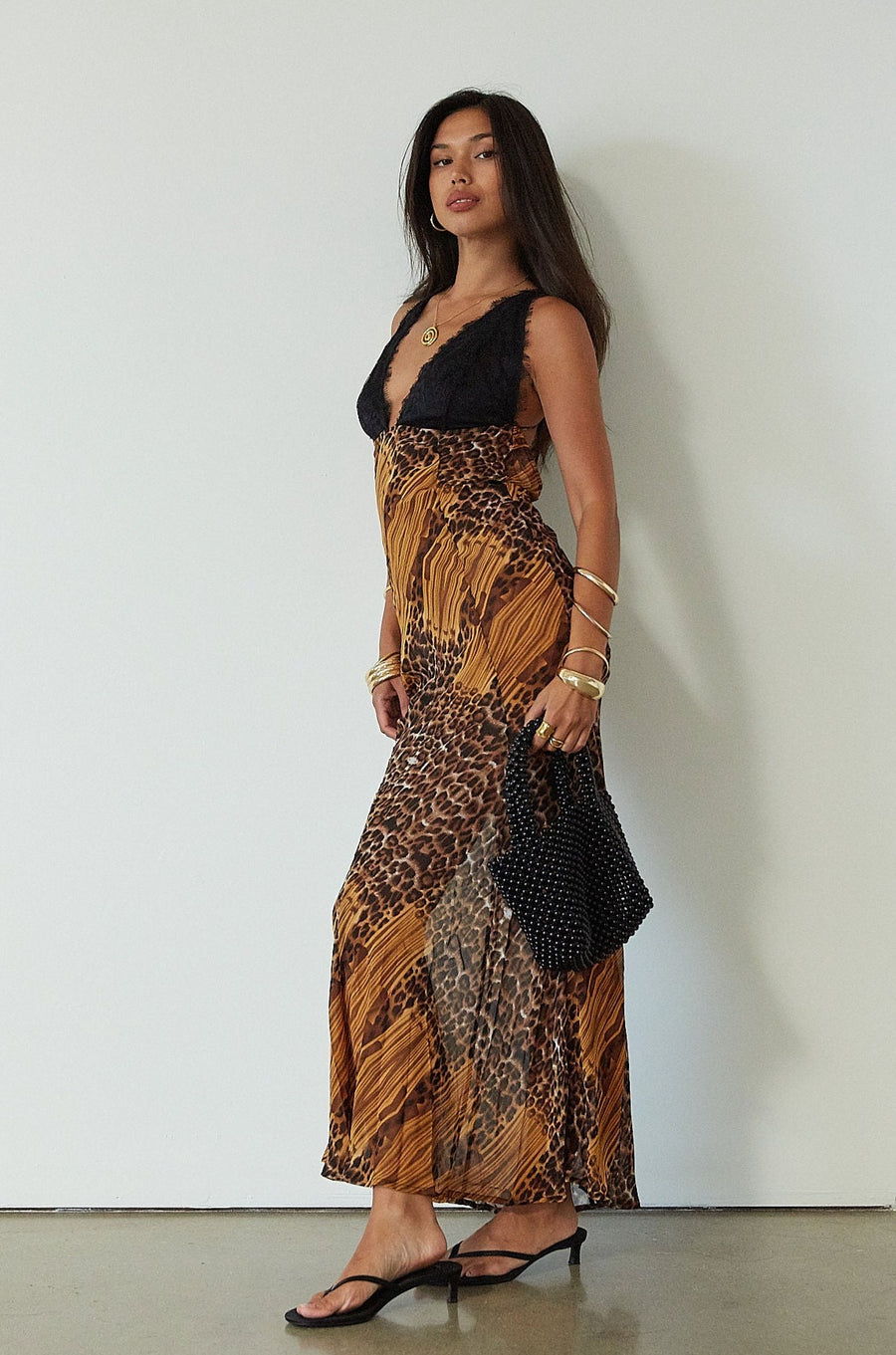 Printed chiffon maxi dress. Adjustable crisscross back straps. Lace cups. Unlined. leopard dress. leopard maxi dress. vacation dress. fancy dinner dress. 
