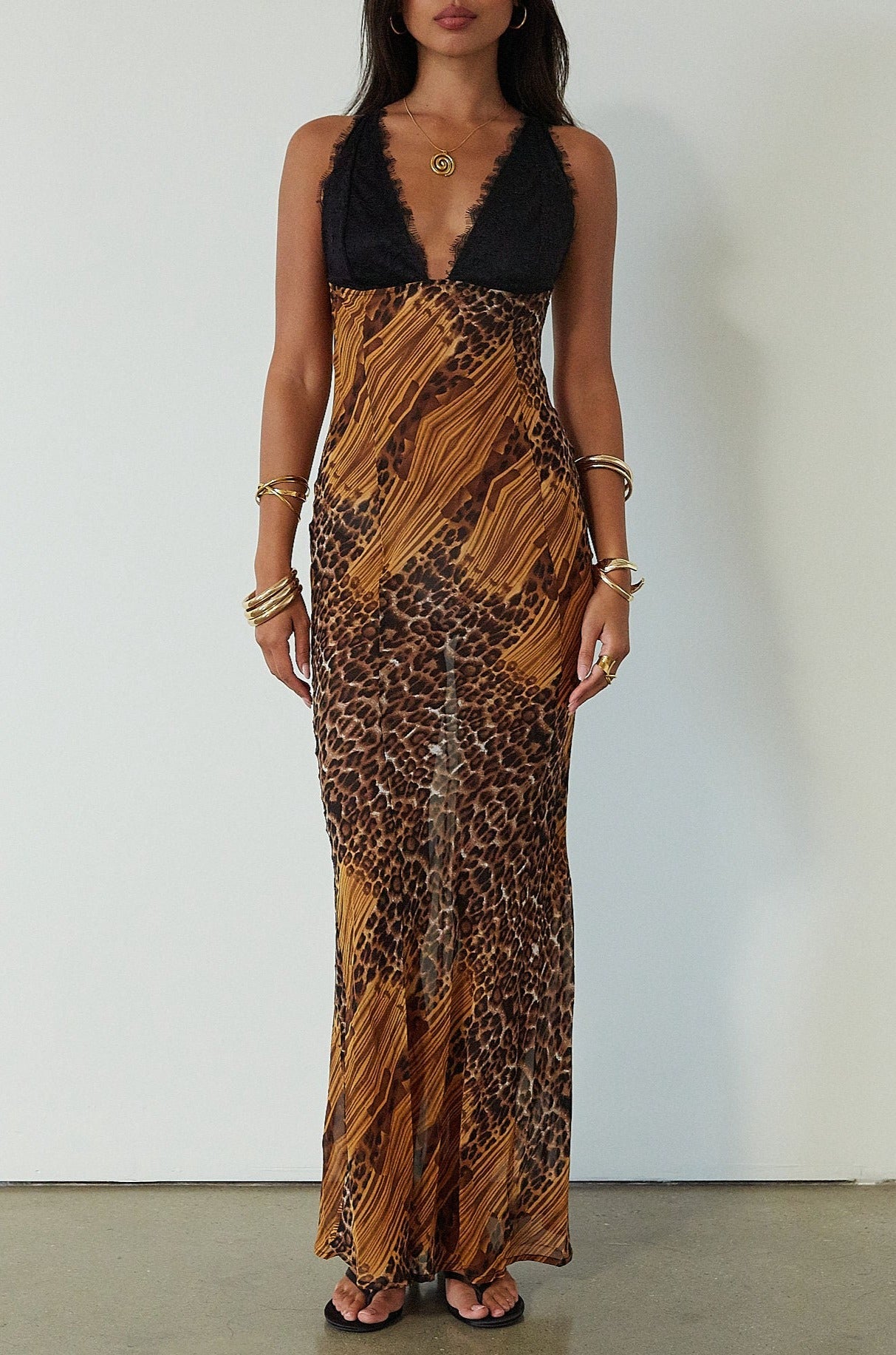 Printed chiffon maxi dress. Adjustable crisscross back straps. Lace cups. Unlined. leopard dress. leopard maxi dress. vacation dress. fancy dinner dress. 
